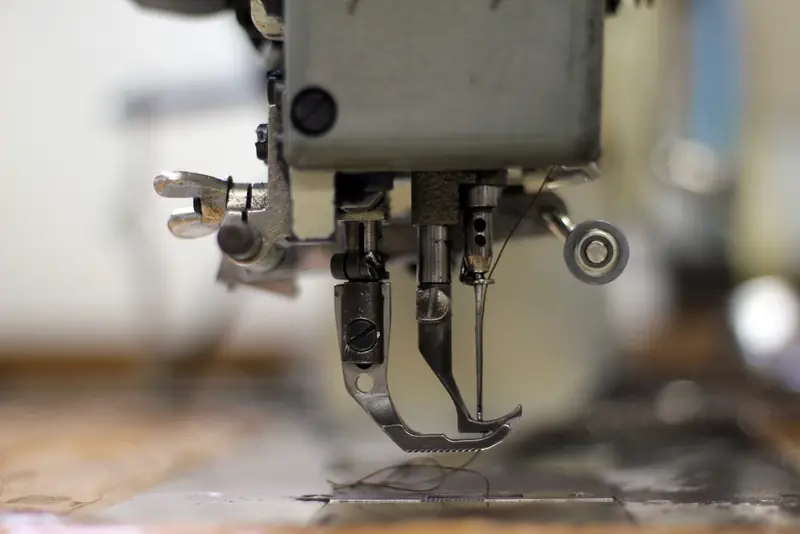 Close-up of a sewing machine needle